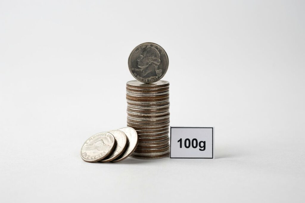 A stack of 20 US nickels that weighs exactly 100 grams