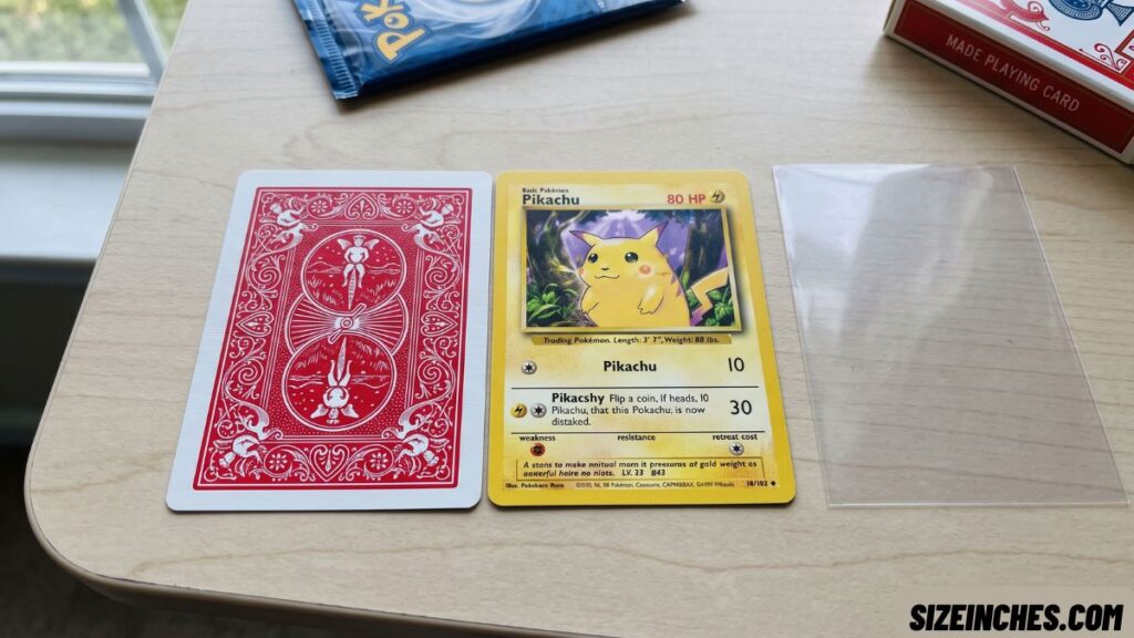 A standard playing card next to a Pokémon card showing the same 2.5 by 3.5 inch size