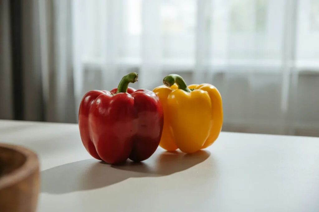 Two medium bell peppers weighing about 300 grams as a produce weight reference