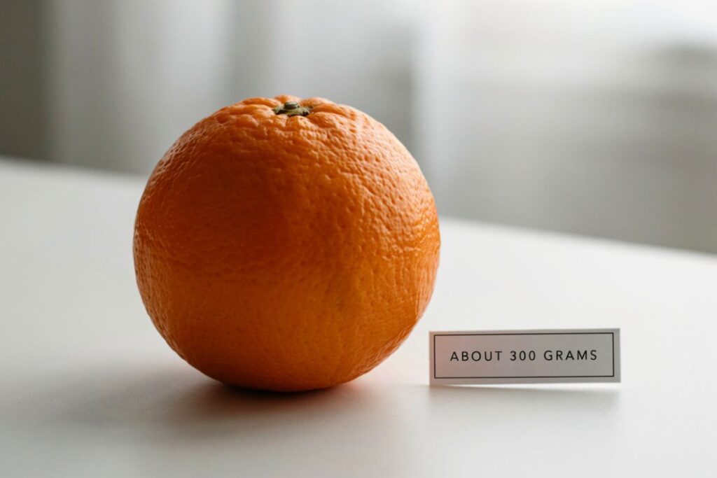 A large navel orange weighing about 250 to 320 grams as a fruit reference