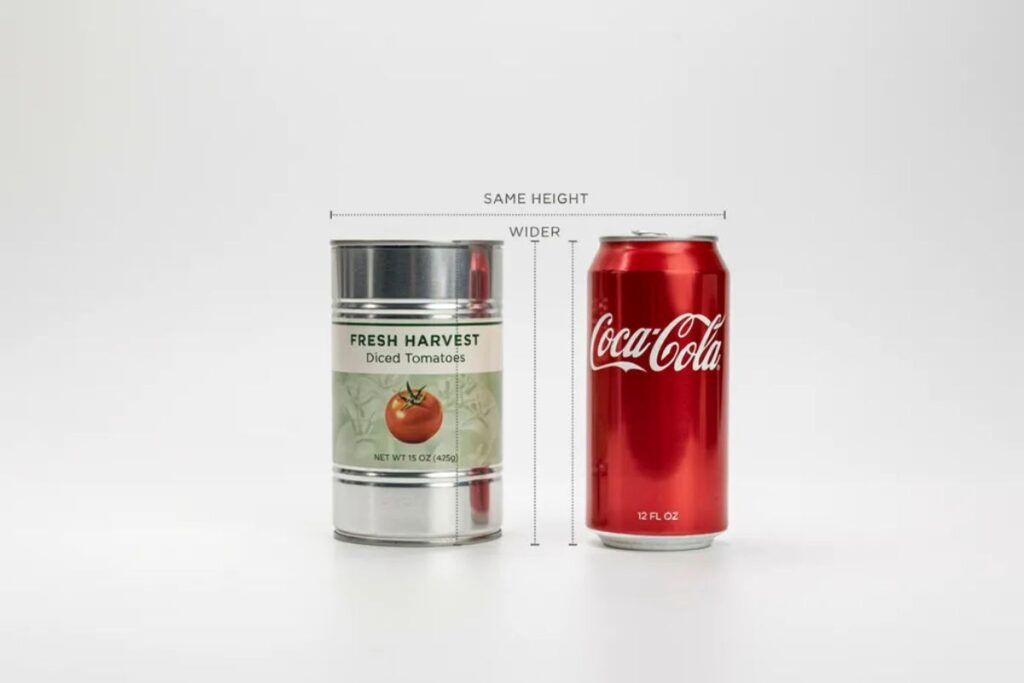 15-ounce vegetable can next to a Coke can comparing soda can dimensions